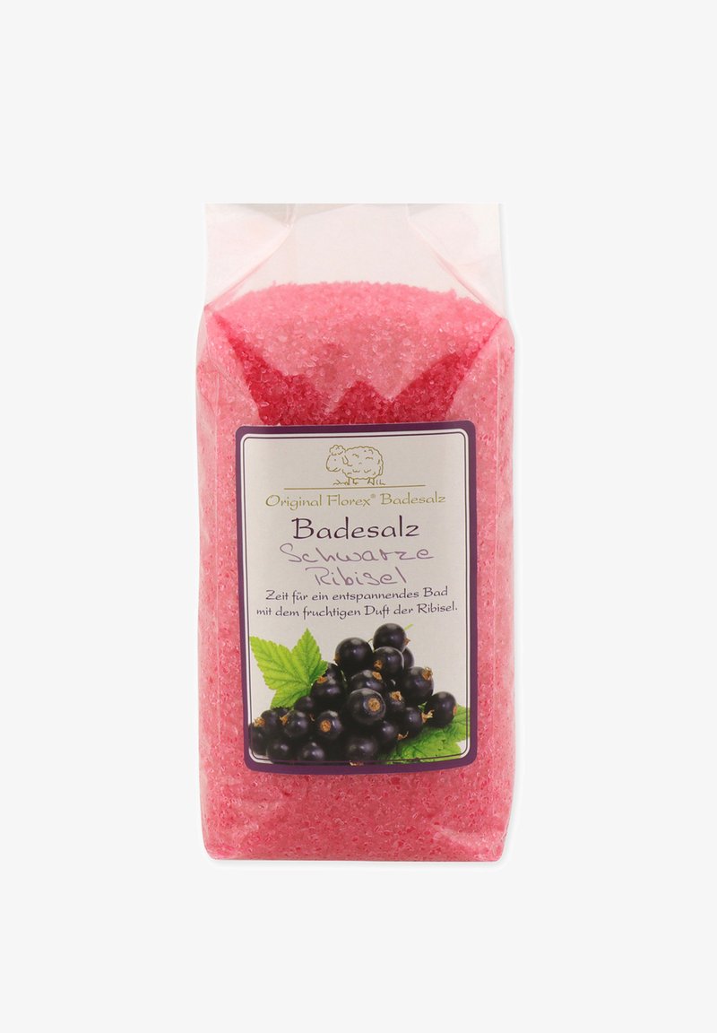 Pink bath salt in a transparent plastic bag, displaying granulated texture. Label features black currants and mint on a white background.