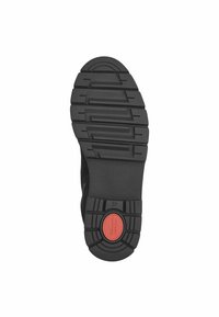 Suela de zapato de goma negra con un patrón de textura, que presenta un acento circular rojo y la marca de tamaño "37" en relieve.