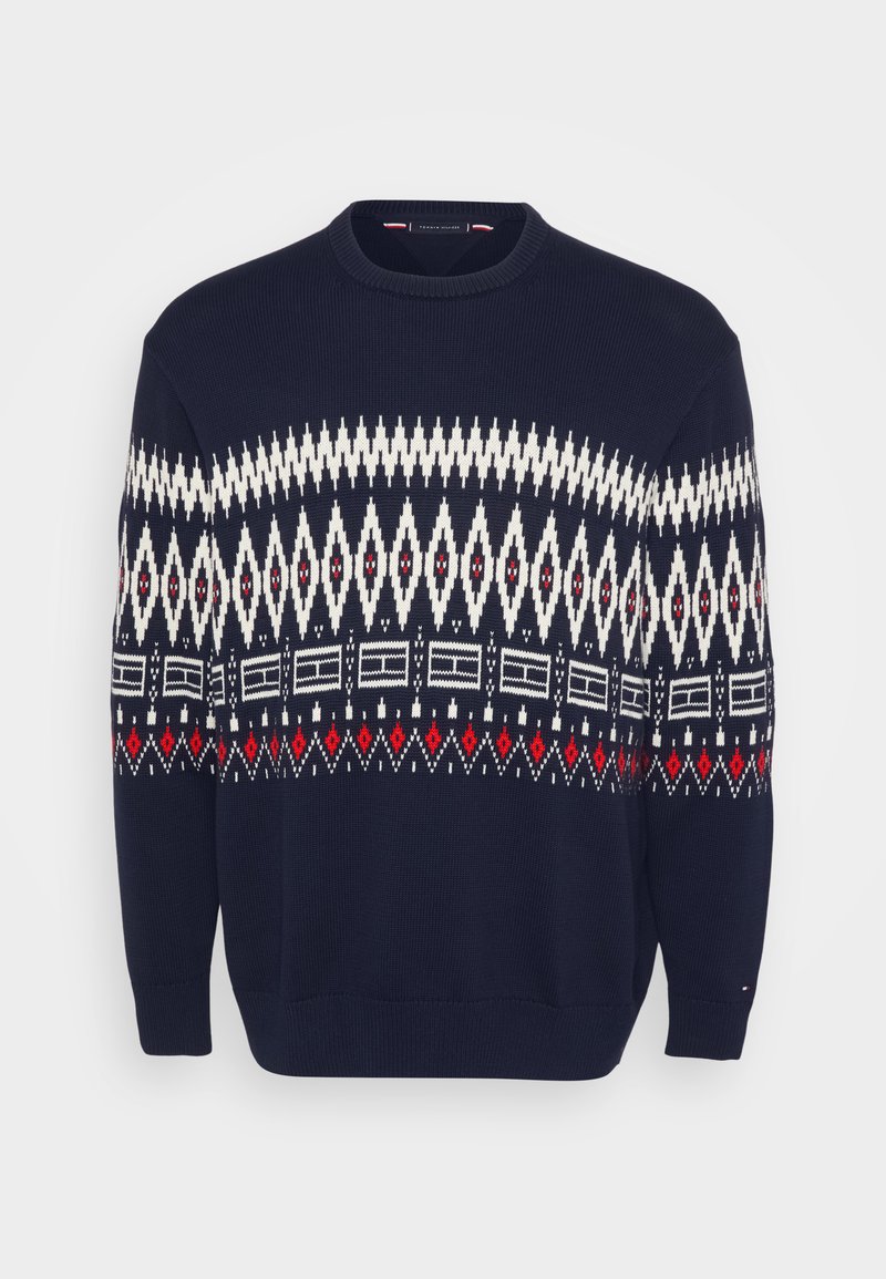 Navy blue sweater with white, red, and black geometric pattern across the chest, ribbed crew neck and cuffs, soft knit texture.