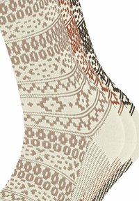 Drei Paar gemusterte Socken in Creme, Braun und Schwarz. Sie weisen geometrische und florale Designs mit kontrastierenden Fersen- und Zehenakzenten auf.