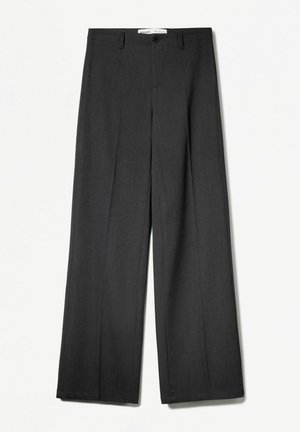 Grijze wijde broek met een op maat gemaakt ontwerp, voorzien van een ritssluiting, knoopsluiting en subtiele textuur. Geen zichtbare patronen of accenten.