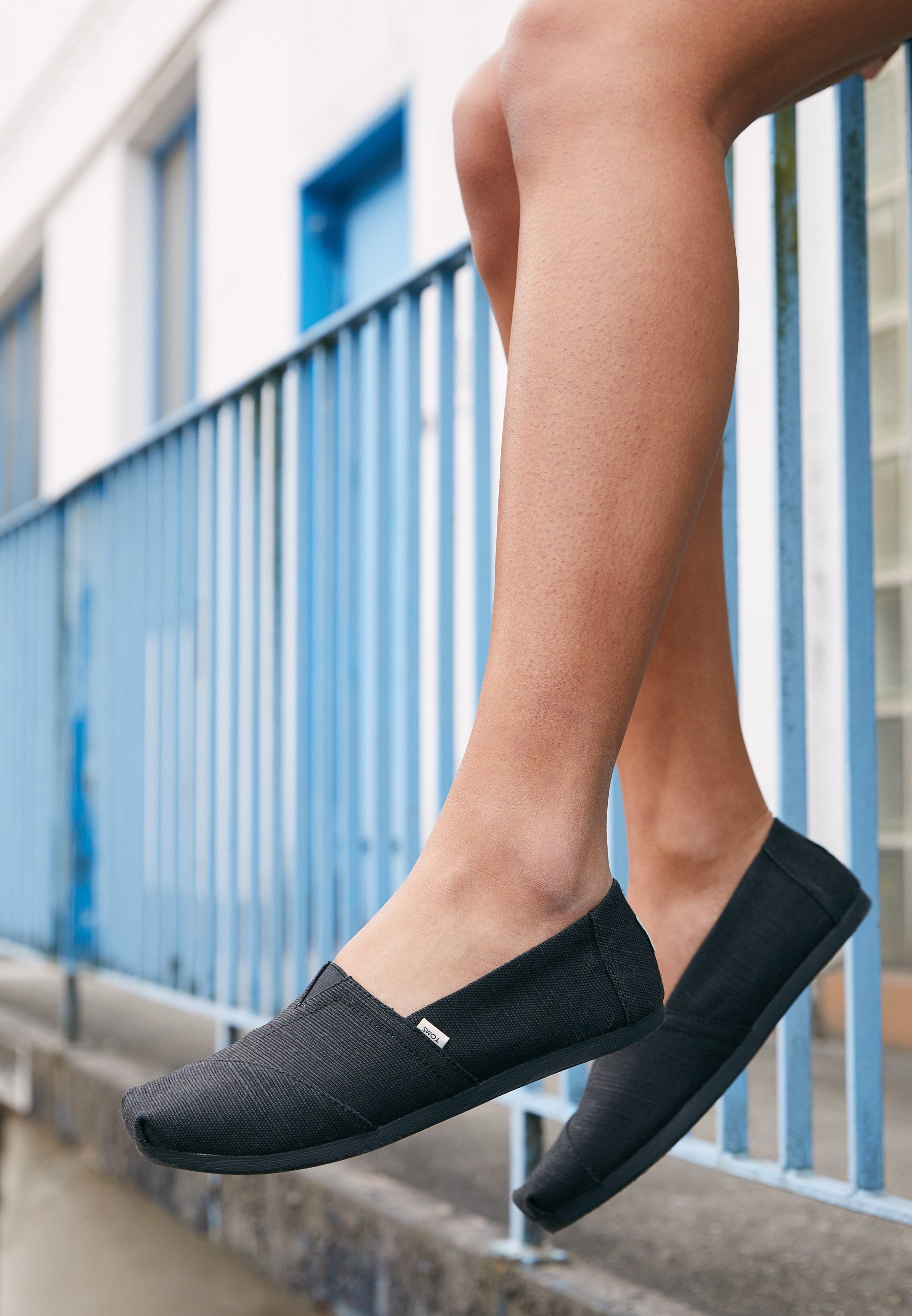 toms black slip ons