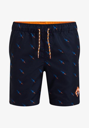 Short de bain bleu marine avec petits motifs de fusées orange et bleu, doublure de la ceinture orange et cordon orange-noir à l'avant au centre.