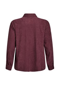 Burgundijas krāsas pogājamā krekla ar teksturētu audumu, garām piedurknēm un apkakli. Iespējama taisna aizmugures daļa un pogātas aproces.