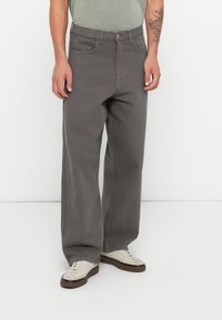 Gray straight-leg pants featuring a classic five-pocket design, button closure, and a smooth, durable fabric texture.