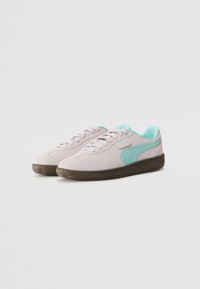 Light purple suede sneakers with turquoise accents, round toe, lace-up closure, and a textured brown rubber sole.