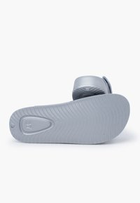Gray rubber sandal with a smooth strap and ridged sole. Features a rounded toe and molded patterns on the sole for traction. Size 37.