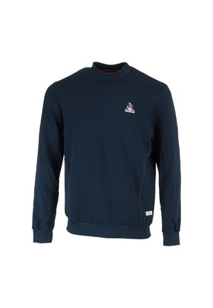 Sweat-shirt bleu marine à manches longues avec col rond, petit logo Le Coq Sportif sur la poitrine, poignets et base côtelés.