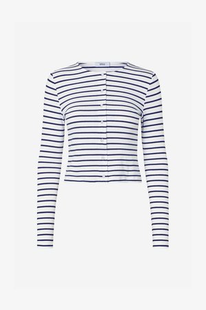 Long-sleeve, cropped cardigan in white with navy stripes. Features a round neckline and five front buttons for closure. Soft ribbed texture.