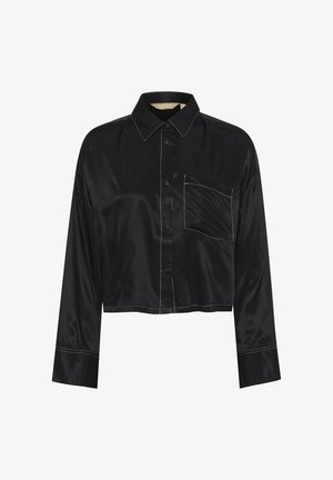 Fekete selyem crop ing hosszú ujjakkal, gombos elejével és mellzsebbel, kontrasztos fehér öltéssel díszítve.