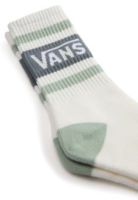 Bílé bavlněné ponožky s zelenými a šedými pruhy; mají žebrovanou strukturu a bílou logo "VANS" na horním pruhu.
