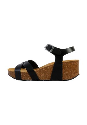 Black wedge sandal with cork midsole, featuring cross straps and adjustable ankle strap, smooth texture, and a slight heel.