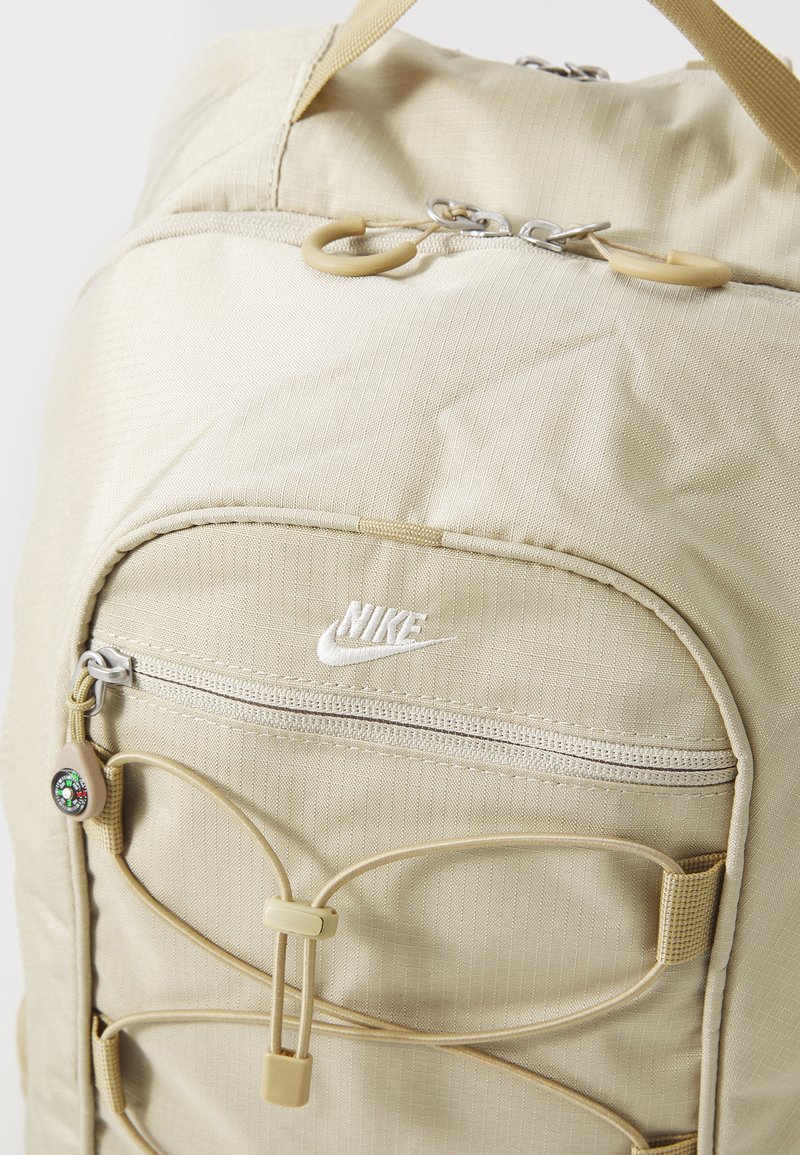 beige nike backpack Sportswear RPM On the front Nike Backpack - Durable &