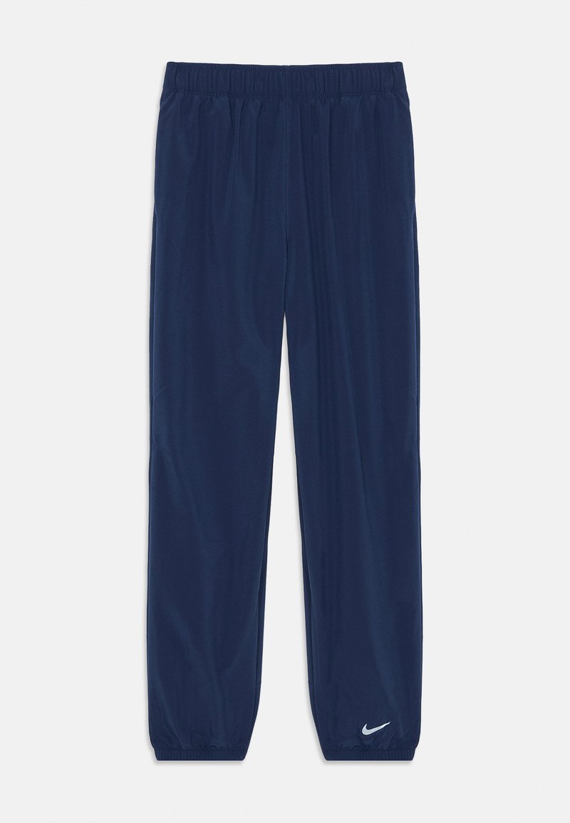 Marineblå idrettsbukser laget av glatt stoff, med et elastisk liv og en hvit Nike-logo nederst på venstre ben.