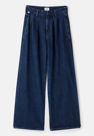 Wide-leg blue denim trousers with pleats, featuring a high waist, front pockets, and a textured finish. The fabric is thick and sturdy.