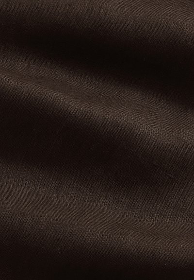 Dark brown linen fabric with visible weave texture and subtle folds creating soft shadows.