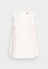 Ärmlös vit blus med en spetsinsats och vågig halsringning. Slät tyg, avslappnad passform och rundad nederkant.