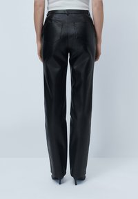 Black leather trousers with a high waist, wide-leg fit, back pockets, and a smooth texture, designed for a contemporary look.