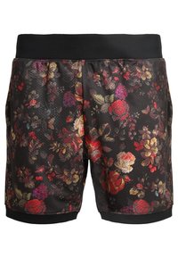 Shorts à imprimé floral en noir avec un tissu en maille léger et respirant. Dotés d'une ceinture élastique et d'accents d'ourlet noirs.