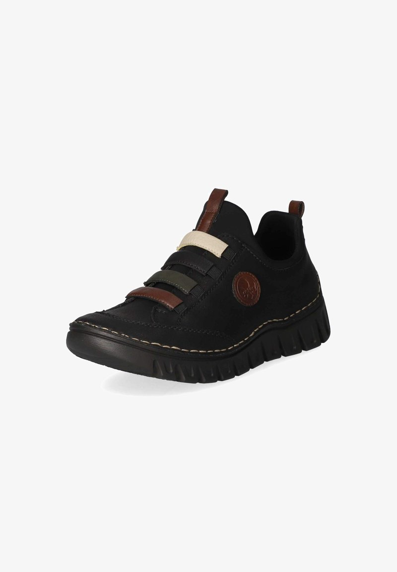 Chaussure décontractée noire avec semelle épaisse, brides élastiques marron, vertes et beige, languettes marron et patch logo rond marron sur le côté.