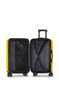 Valise rigide jaune avec un intérieur noir ; elle dispose d'une poignée télescopique, de roues multidirectionnelles et de compartiments de rangement à l'intérieur.
