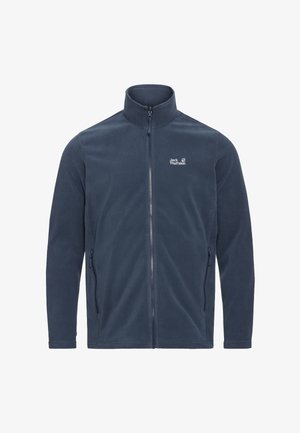 Giacca in pile blu navy con collo alto, cerniera frontale completa, tasche laterali e un piccolo logo bianco sul petto. Tessuto morbido.