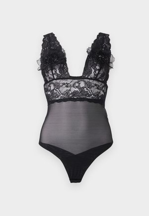 Black lace bodysuit with sheer panels, deep V-neck, and decorative floral accents on the straps. Features a thong cut and intricate lace design.