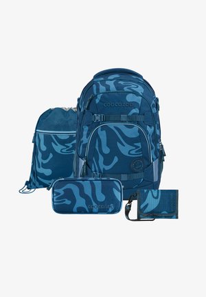 Blue camouflage backpack, drawstring bag, pencil case, and wallet. Textured fabric. Distinctive branding and zippers visible on all items.