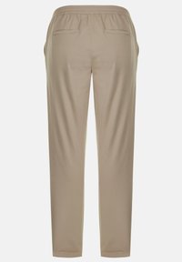 Beige, lockere Hose mit glatter Textur, elastischem Bund und zwei Gesäßtaschen. Schmal zulaufendes Bein-Design.