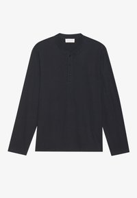 T-shirt henley noir à manches longues en tissu doux, avec un col rond, une patte de boutonnage à trois boutons et une coupe décontractée.