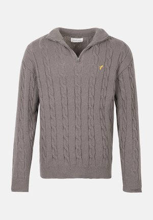 Hall jaelakkudega sviiter, millel on veerandzipi krae ja väike kollane tikkimine vasakul rinnal, pika varrukaga ning ribades käeotsad ja alläär.