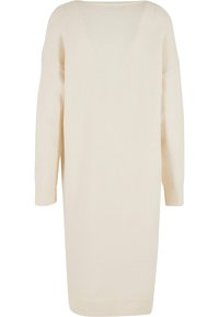 Ceļa garuma krēmkrāsas džemperkleita ar vaļēju piegriezumu, plašu kakla izgriezumu un trim ceturtdaļas piedurknēm; raksturīgas ribotas aproces. Mīksts adījuma tekstūra.