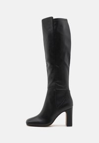 Black knee-high boot made from smooth leather. Features a rounded toe and a chunky heel with a textured side panel for added detail.
