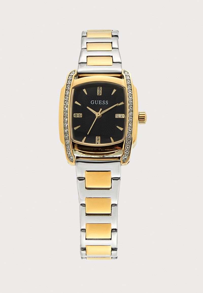 Златен и сребърен метален часовник Guess с черен циферблат, златни часови индекси и кристали по златния безел.