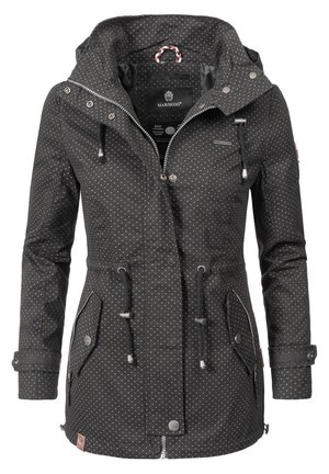 Black waterproof jacket with white polka dots, adjustable hood, drawstrings at waist, zippered and flap pockets, and snap-button closure.