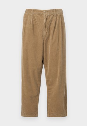 Corduroy pants in a light brown color with a textured ribbed pattern, featuring a button closure and relaxed fit.