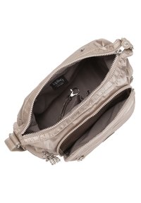 Beige fabric handbag with a top zipper, two inner compartments, and a keychain clip. Silver hardware accents add detail to the design.
