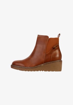 Bottes basses en cuir marron avec une semelle compensée, des panneaux latéraux élastiques et une languette de traction à l'arrière. Texture lisse avec des matériaux contrastés.