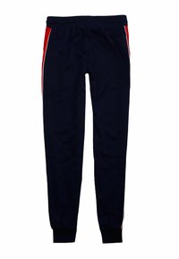 Navy sweatpants made of soft fabric featuring red and white side stripes, an elastic waistband, and ribbed cuffs at the ankles.
