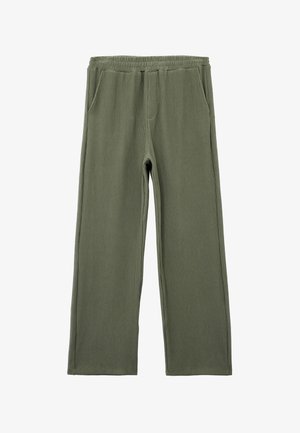 Vihreät ribbikankaiset housut, joissa on rento malli, joustava vyötärö ja kaksi sivutaskua. Kankaan pinta on teksturoitu ja siinä on pystysuorat raidat.