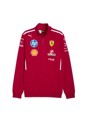 Red long-sleeve quarter-zip sweatshirt featuring white accents, Ferrari logo, and various sponsor patches on chest and sleeves. Soft fabric.