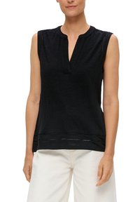 Black sleeveless top with a placket neckline, featuring textured fabric and subtle horizontal cutouts near the hem. Smooth finish and relaxed fit.