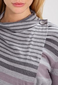 Gray and purple striped sweater with a cowl neck, featuring a button detail on the shoulder and soft knit texture.