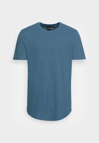 Blue short-sleeve t-shirt made from soft cotton, featuring a round neck and a curved hem. Smooth texture with no visible patterns or accents.