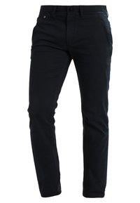 Mörkblå bomullschinos med slim fit-design, utrustade med två framfickor, knappstängning och subtila sömdetaljer på sidorna.