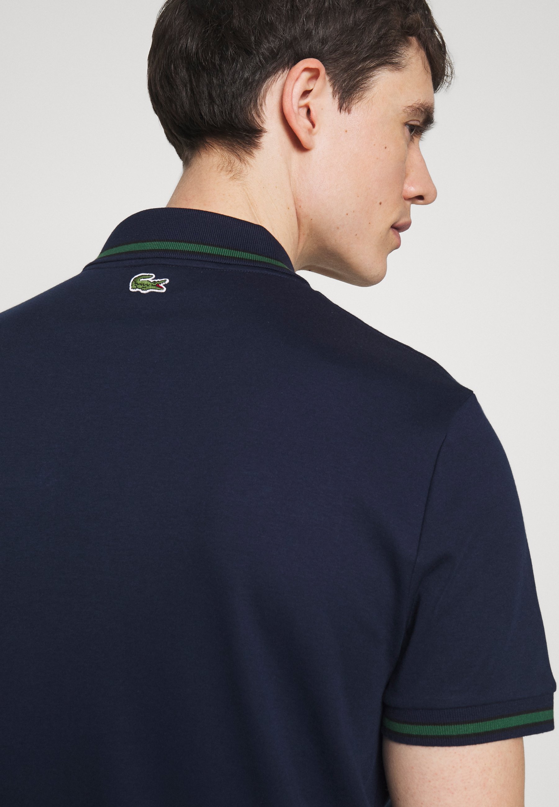 black and green polo shirt