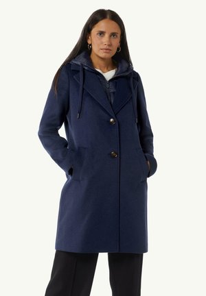 Navy wool-blend coat with a button closure, large pockets, and a hoodie. The design features a tailored silhouette and soft texture.