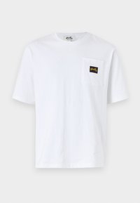 White cotton t-shirt featuring a chest pocket with a black and yellow logo tag. Short sleeves and a classic crew neck design.