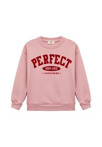 Vaaleanpunainen puuvillapaita, jossa on resorit hihansuissa ja helmassa. "PERFEKTI" lihavoituna punaisella tekstillä, jonka alla lukee "ONNEA" ja "TEHKÄÄ AINA PARHAANNE."