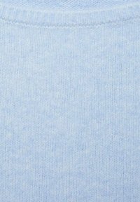 Light blue sweater with a soft, textured knit, featuring a ribbed neckline. The fabric appears cozy and evenly woven, with no visible patterns.